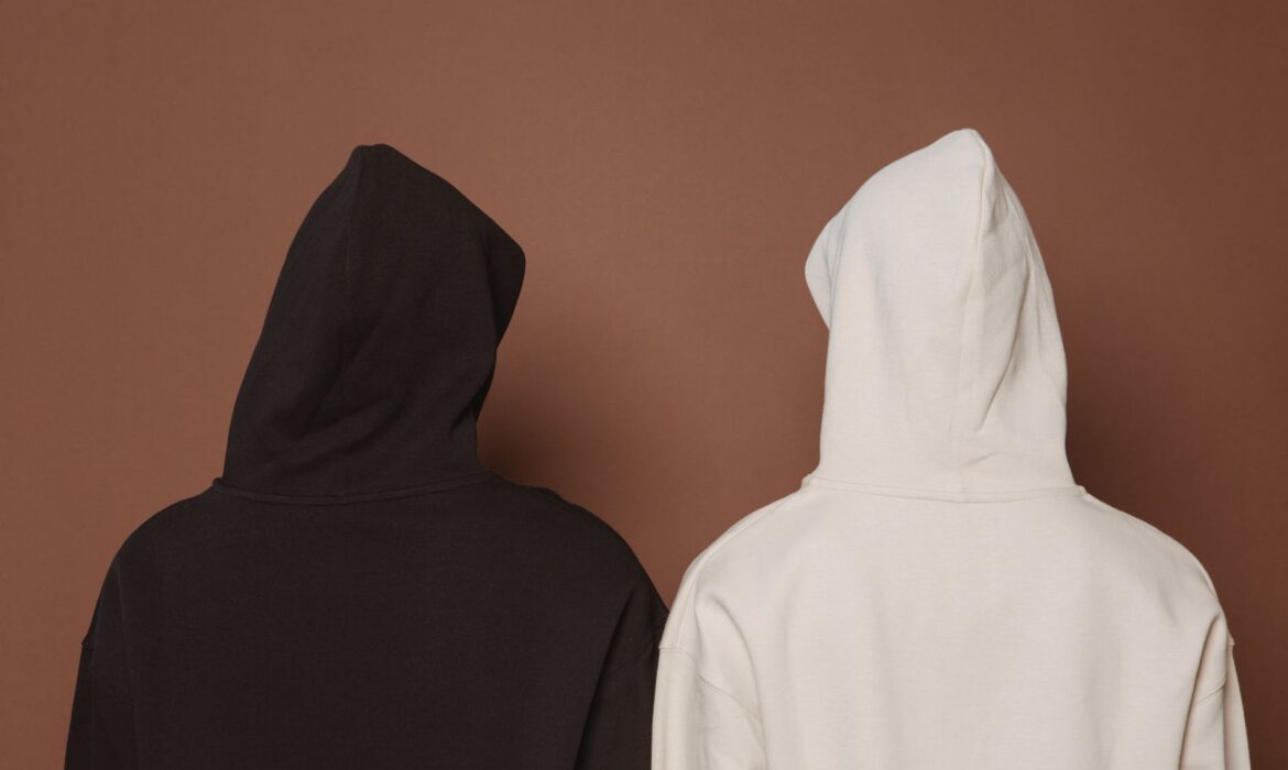 models and black and white hoodies in studio
