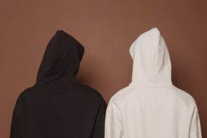 models and black and white hoodies in studio